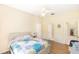 Large bedroom offers wood floors, a ceiling fan, and multiple access points for convenience and flow at 32025 Timberlake Dr, Mount Dora, FL 32757
