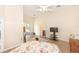 Spacious bedroom boasts wood floors, neutral tones, and a screened porch entrance for flexible living at 32025 Timberlake Dr, Mount Dora, FL 32757