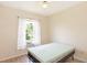 Bedroom featuring a bright window with sheer curtains and a fan on the ceiling at 32025 Timberlake Dr, Mount Dora, FL 32757