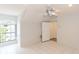 Bonus room with a large window, tiled floors, and neutral-toned walls at 32025 Timberlake Dr, Mount Dora, FL 32757