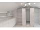 Bonus room with custom storage and shelving; tiled floors, ceiling fan, and neutral-toned walls at 32025 Timberlake Dr, Mount Dora, FL 32757
