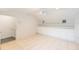 Bonus room featuring custom storage and shelving; tiled floors, ceiling fan, and neutral-toned walls at 32025 Timberlake Dr, Mount Dora, FL 32757