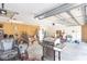 Open garage featuring bright lighting, work areas, and ample space for vehicles and storage at 32025 Timberlake Dr, Mount Dora, FL 32757
