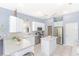 Functional kitchen with white cabinets, stainless steel appliances, and tile flooring at 32025 Timberlake Dr, Mount Dora, FL 32757