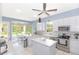 Well-lit kitchen with white cabinets, stainless steel appliances, and a breakfast nook at 32025 Timberlake Dr, Mount Dora, FL 32757