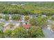 Aerial image showcasing the property nestled among mature trees in a quiet residential area at 3904 Valencia Grove Ln, Orlando, FL 32817
