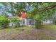 Expansive backyard features a screened-in porch and lush greenery, perfect for outdoor living at 3904 Valencia Grove Ln, Orlando, FL 32817