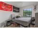 Cozy bedroom featuring a queen bed, a window for natural light, and neutral paint at 3904 Valencia Grove Ln, Orlando, FL 32817
