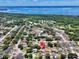 Aerial view showcases the property's location near Lake Monroe and major roadways, surrounded by lush greenery at 428 Coventry Estates Blvd, Deltona, FL 32725