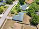 Overhead view of the property showcasing its location within a neighborhood with lush greenery and tree-lined streets at 428 Coventry Estates Blvd, Deltona, FL 32725