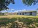 Expansive backyard featuring a well-maintained lawn and partial views of the home's exterior at 428 Coventry Estates Blvd, Deltona, FL 32725