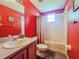 Colorful bathroom featuring a tub, shower, toilet, and sink with a mirror at 428 Coventry Estates Blvd, Deltona, FL 32725