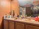 A bathroom featuring a mirror, double sink vanity, and other decor at 428 Coventry Estates Blvd, Deltona, FL 32725
