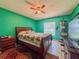 A bedroom featuring carpet, a ceiling fan, a bed, a window, and other decor at 428 Coventry Estates Blvd, Deltona, FL 32725