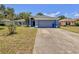 Inviting single-story home with a gray two-car garage and well-kept lawn at 428 Coventry Estates Blvd, Deltona, FL 32725