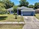Charming single-story home with a well-manicured lawn and an attached two-car garage, located in a peaceful neighborhood at 428 Coventry Estates Blvd, Deltona, FL 32725