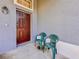 Inviting front porch with a charming door and comfortable seating at 428 Coventry Estates Blvd, Deltona, FL 32725
