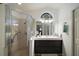 Modern bathroom featuring a glass-enclosed shower, stylish vanity, and ample lighting at 4300 Leafway Cir, Leesburg, FL 34748