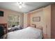 Neat bedroom with desk, comfortable bed and a built-in wardrobe for optimal storage at 4300 Leafway Cir, Leesburg, FL 34748