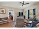 Cozy living room with hardwood floors, neutral colors, and comfortable seating arrangements at 4300 Leafway Cir, Leesburg, FL 34748