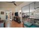 Cozy living room with comfortable seating, a ceiling fan, and a view into another room at 4300 Leafway Cir, Leesburg, FL 34748