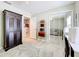 Bedroom with mirrored closet doors, a sofa and a desk at 4520 Eaglewood Dr, Leesburg, FL 34748