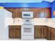 A gourmet kitchen featuring ample dark cabinetry, modern appliances, and plenty of countertop space at 4520 Eaglewood Dr, Leesburg, FL 34748