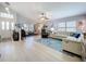 Spacious living room with vaulted ceilings, light wood floors, and neutral tones at 4520 Eaglewood Dr, Leesburg, FL 34748