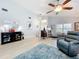Open living room with vaulted ceiling, recessed lighting, and stylish decor at 4520 Eaglewood Dr, Leesburg, FL 34748