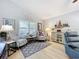 Comfortable living room featuring nautical-themed decor and stylish seating at 4520 Eaglewood Dr, Leesburg, FL 34748
