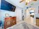 Living room featuring a media cabinet and a large television at 4520 Eaglewood Dr, Leesburg, FL 34748