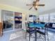Versatile sunroom offering views of the kitchen, backyard, and comfortable seating arrangements at 4520 Eaglewood Dr, Leesburg, FL 34748