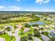 Serene neighborhood featuring single-Gathering homes, winding streets, and tranquil water features at 5620 Illumination Ln, Leesburg, FL 34748