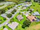 Overhead of houses in planned community, close to ponds and green areas at 5620 Illumination Ln, Leesburg, FL 34748