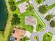 Birds-eye view showcases home with mature landscaping, surrounded by lush greenery at 5620 Illumination Ln, Leesburg, FL 34748
