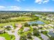 Aerial view of the property showcasing its location and the surrounding neighborhood amenities at 5620 Illumination Ln, Leesburg, FL 34748