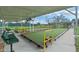 Enjoy bocce ball on the community courts, featuring shaded seating and well-maintained playing surfaces for friendly competition at 5620 Illumination Ln, Leesburg, FL 34748