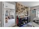 Organized garage/work area featuring a workbench, tool storage, and access to the house at 5620 Illumination Ln, Leesburg, FL 34748