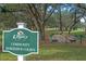 Horseshoe courts available in the community, with mature trees and a green space for recreation at 5620 Illumination Ln, Leesburg, FL 34748