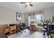 Functional home office space with a wooden desk, exercise equipment, and a bright window view at 5620 Illumination Ln, Leesburg, FL 34748