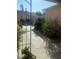 Lush backyard features hibiscus bushes, pavers, and an outdoor seating area at 627 Nuevo Leon Ln, The Villages, FL 32159