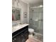 Modern bathroom features a glass-enclosed shower, stylish vanity, and elegant fixtures at 627 Nuevo Leon Ln, The Villages, FL 32159