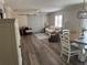 Spacious living area with stylish furniture, barn doors, and an open layout at 627 Nuevo Leon Ln, The Villages, FL 32159