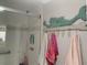 Shower with built in soap niche, mermaid statue, and decorative mosaic at 627 Nuevo Leon Ln, The Villages, FL 32159