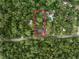 Aerial view showcases the property's secluded location with surrounding trees, lush landscape, and the property lines at 8161 Cr 647, Bushnell, FL 33513