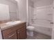 Bathroom boasts a single sink vanity, and a shower over tub at 8161 Cr 647, Bushnell, FL 33513