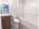 Bathroom with shower, tub combo, tile flooring, vanity, and mirror provides a functional space at 8161 Cr 647, Bushnell, FL 33513