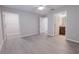 A spacious bedroom with walk-in closet, an en-suite bathroom, and gray wood-look flooring at 8161 Cr 647, Bushnell, FL 33513