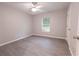 Cozy bedroom with modern gray flooring and a ceiling fan at 8161 Cr 647, Bushnell, FL 33513