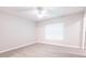 Bedroom featuring gray wood-look flooring and a ceiling fan provides a comfortable and stylish space at 8161 Cr 647, Bushnell, FL 33513